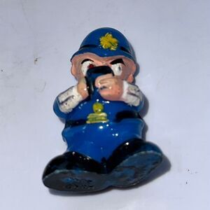 Vintage policeman dressed in blue writing a ticket hard plastic cake topper/toy